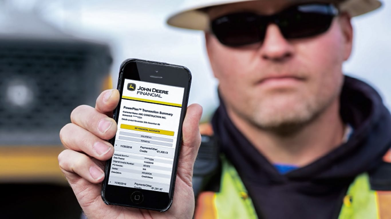 image of construction working showing cell phone screen on John Deere Financial page