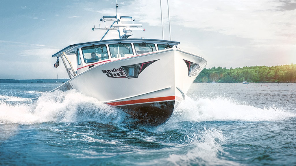 Boat cruising on water powered by a John Deere marine engine.