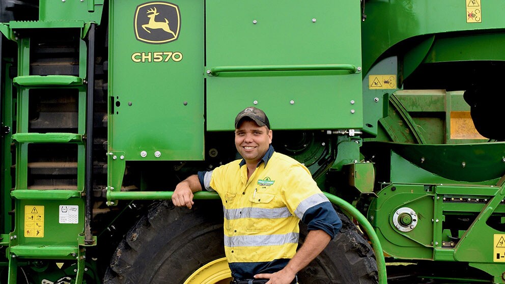 Karl Moschella in front of John Deere equipment