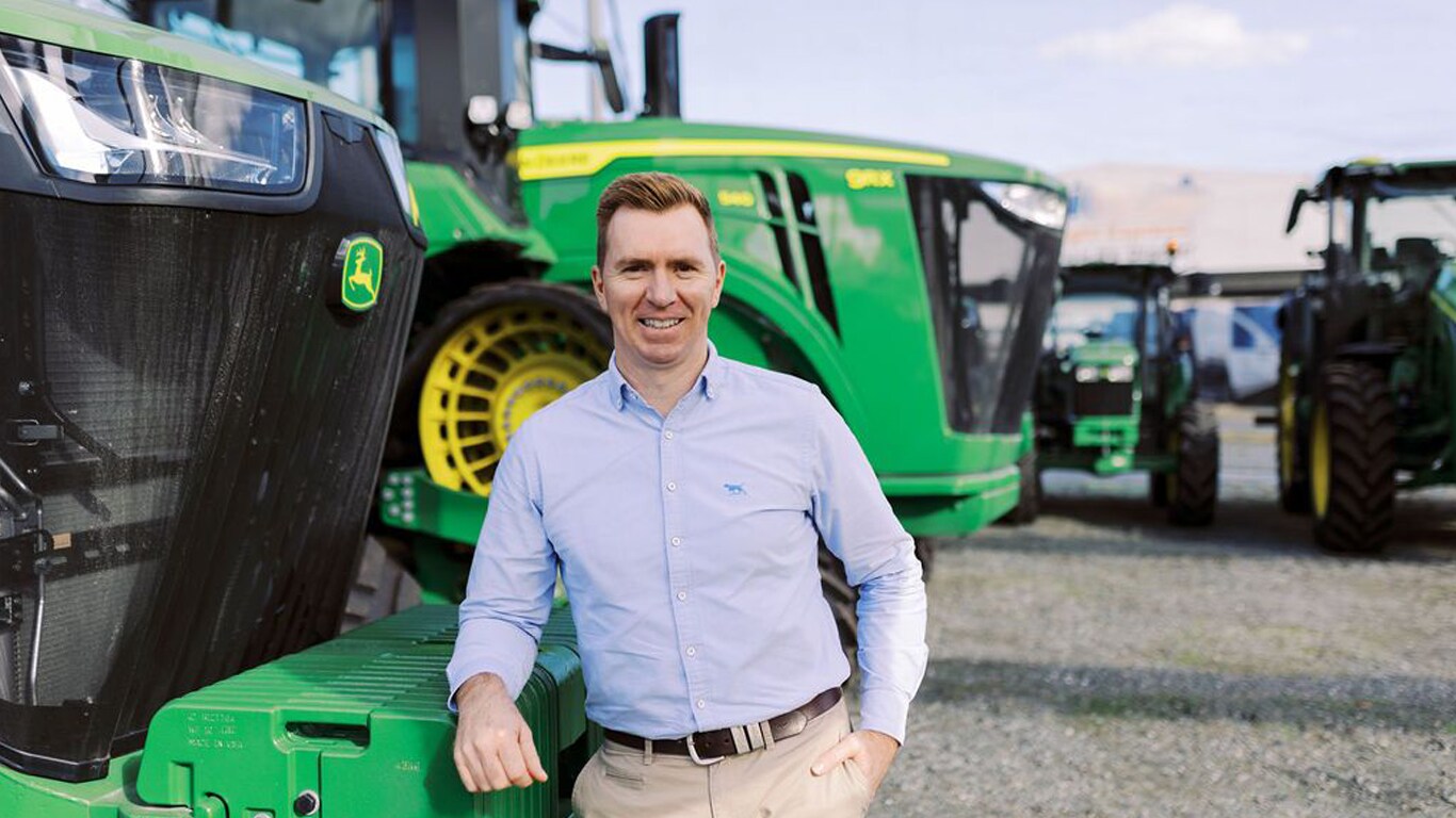 Ben Kelly in front of tractor