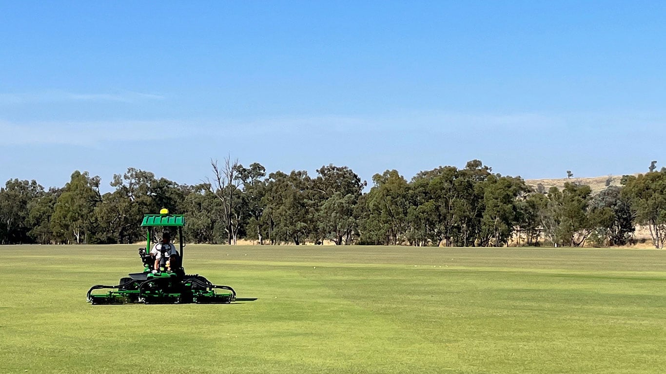 The 8900A PrecisionCut&trade; Fairway Mower out on a green sports field
