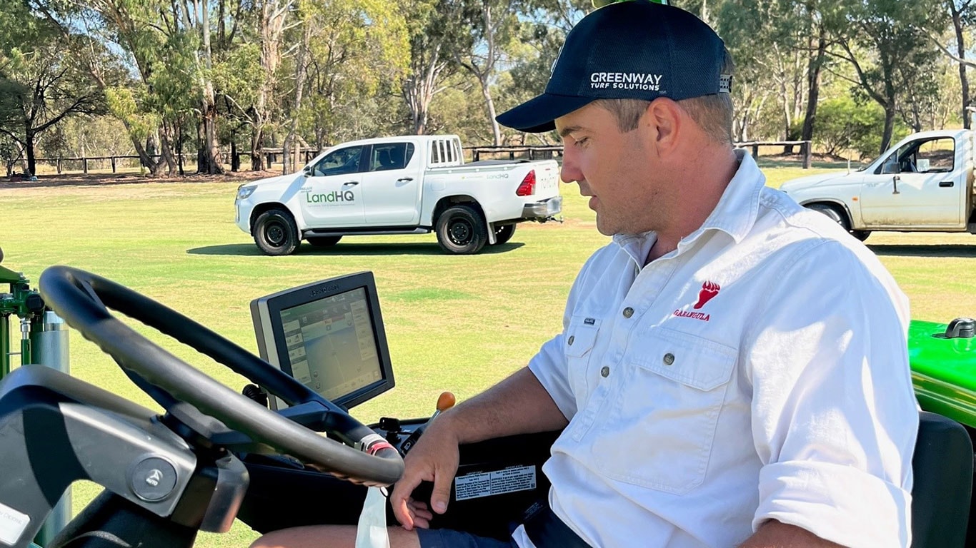 Garangula Polo Club Head Greenkeeper, Kyle Murray sitting in mower looking at screen. 