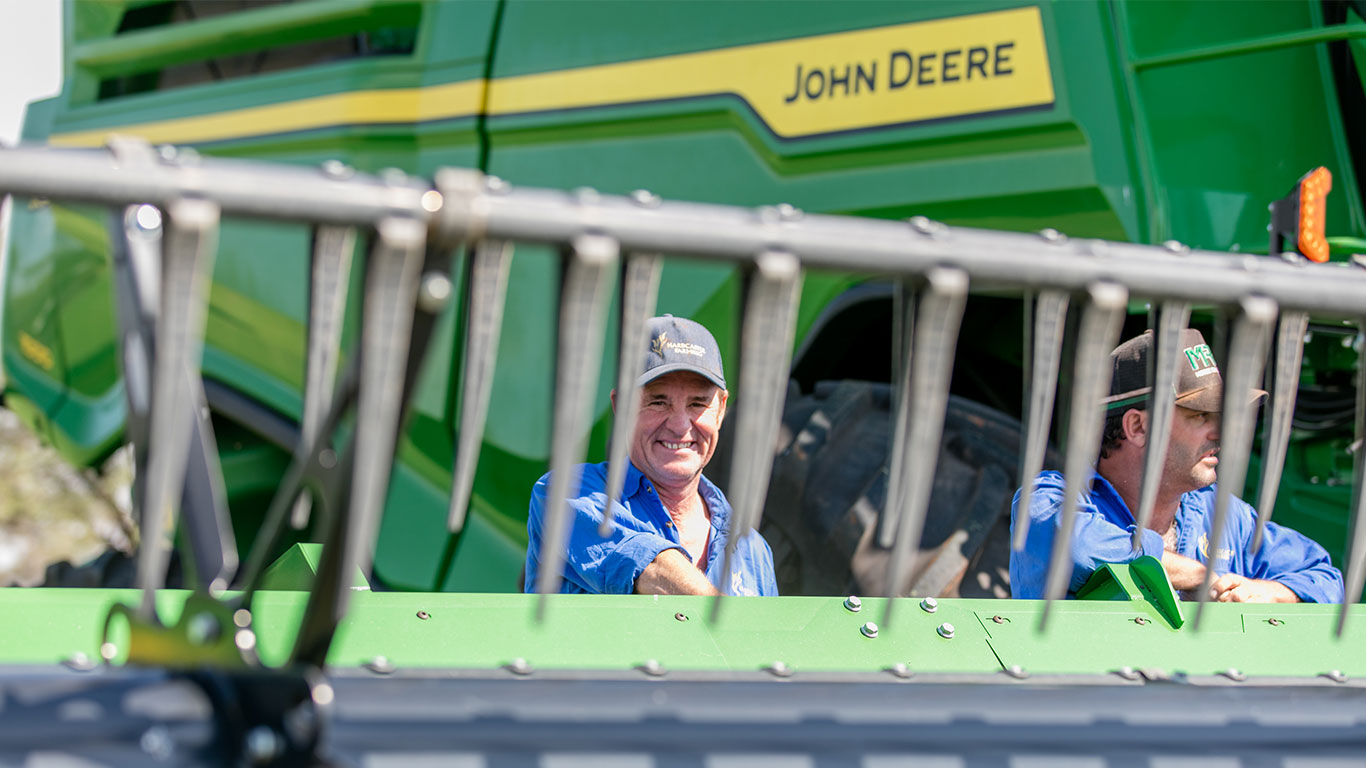 James Hardcastle and Jeff Fairbanks with an X9 Combine Harvester.