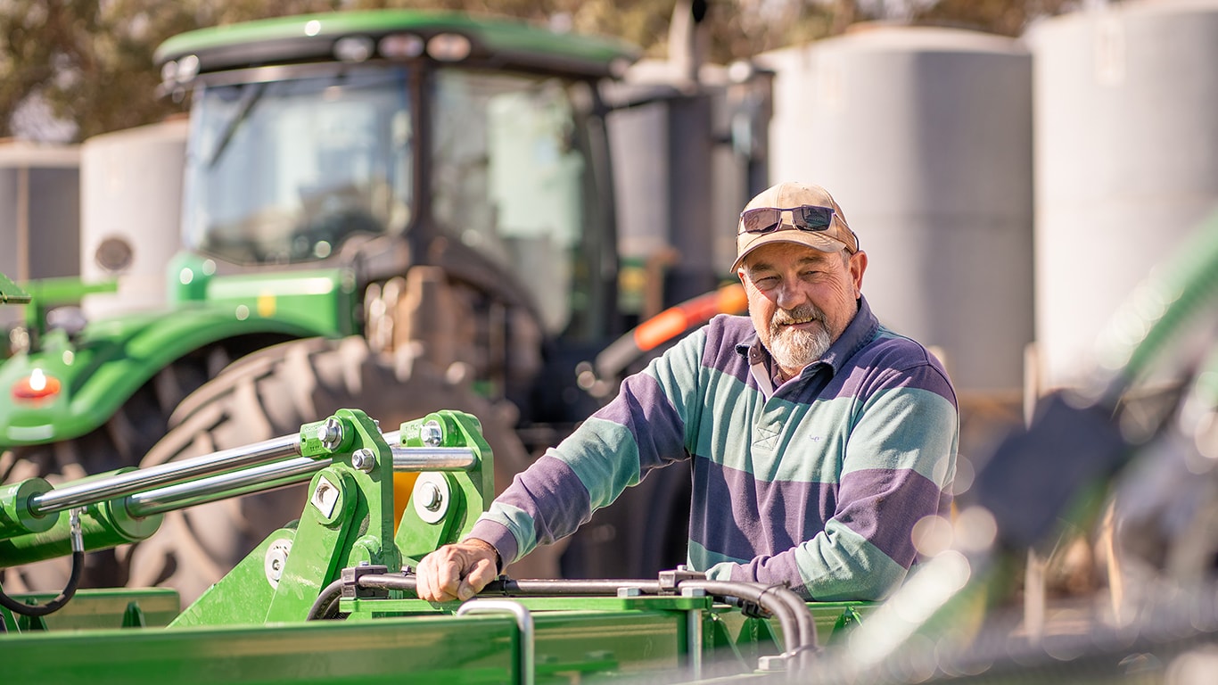 Farmer Wick Dayman with farming machinery