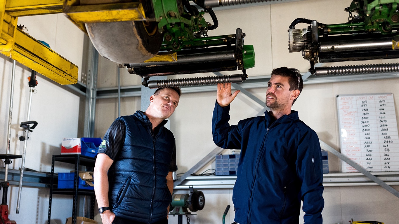 Jack Latchford from AFGRI Equipment in Perth (left) and Tom Tristram inspecting a mower reel.