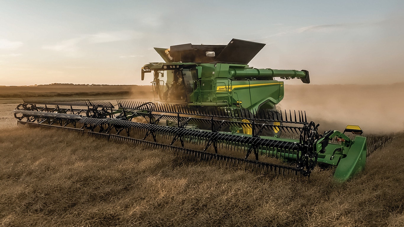 John Deere combine harvester in paddock