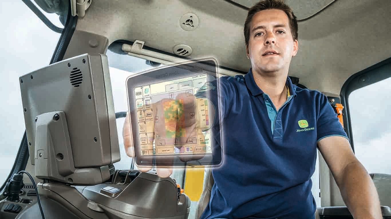 a man touching a holographic monitor display