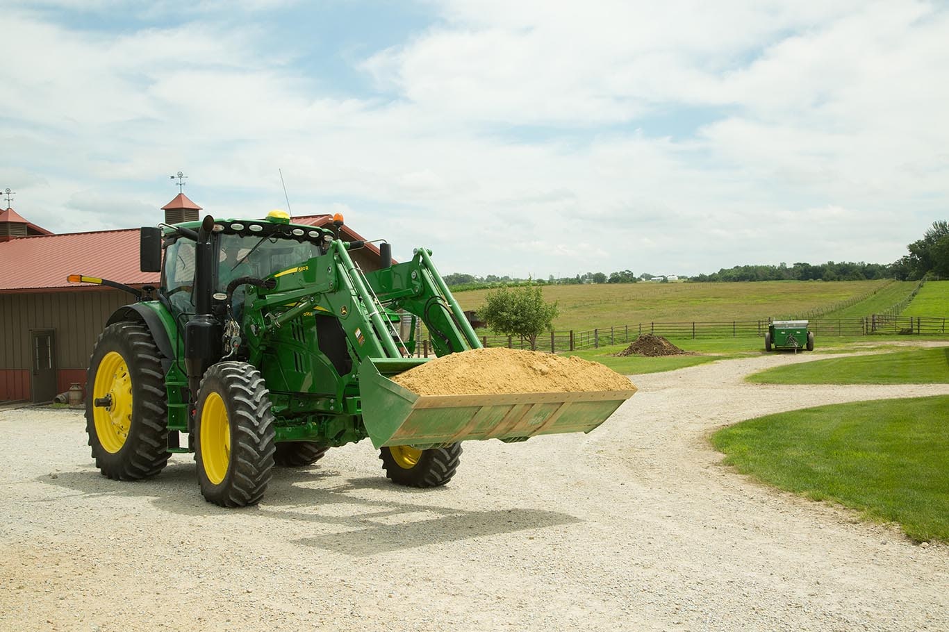 A 155 L per minute hydraulic pump is available to increase front-loader cycle times