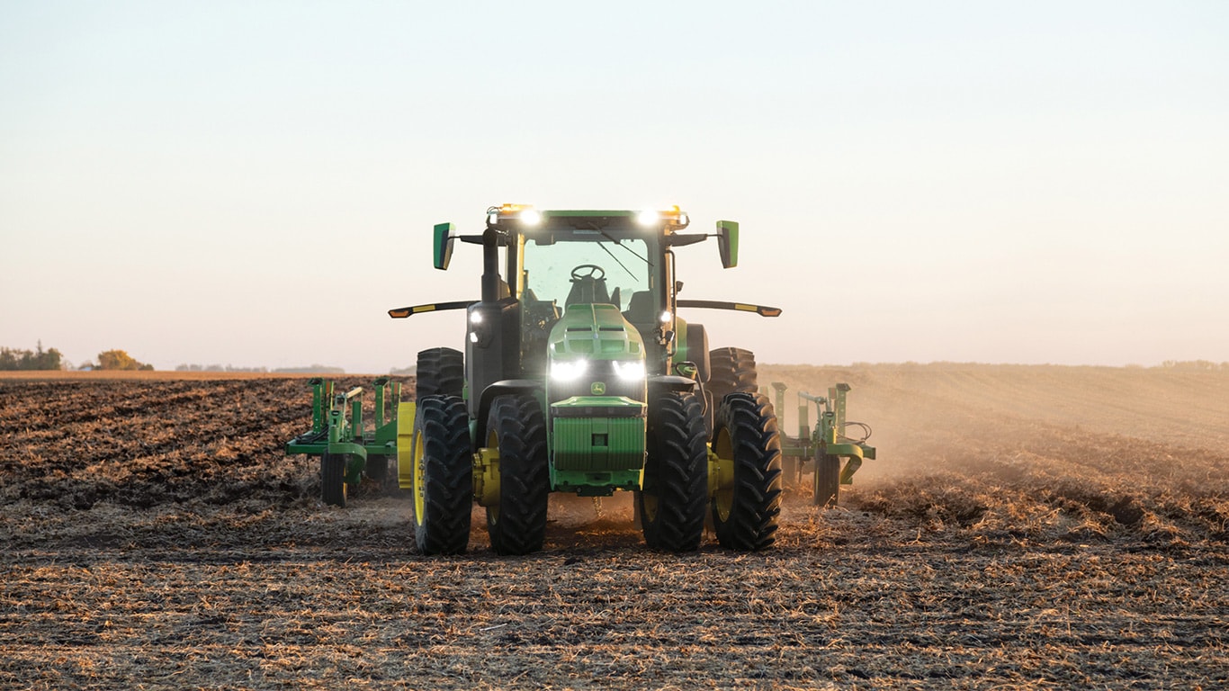 John Deere 8R Autonomous Tractor in a field