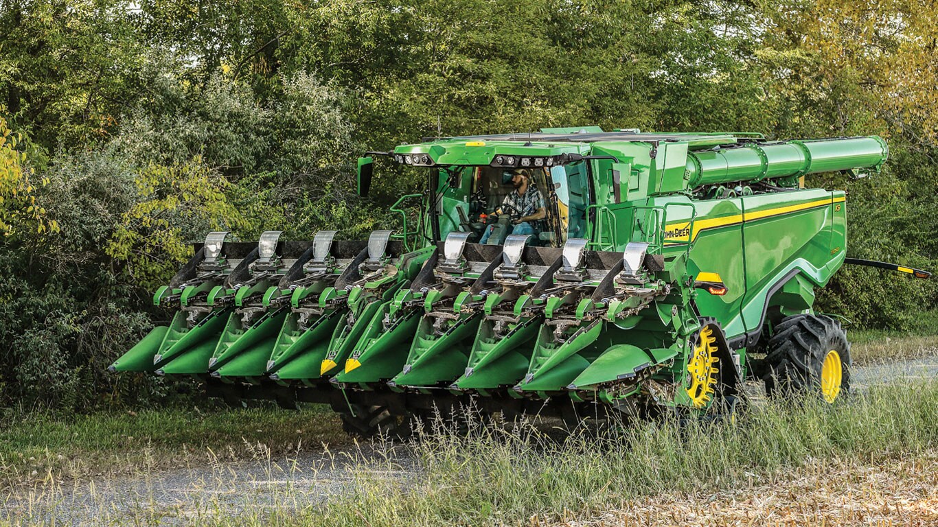 Man operating CF Folding Corn Heads