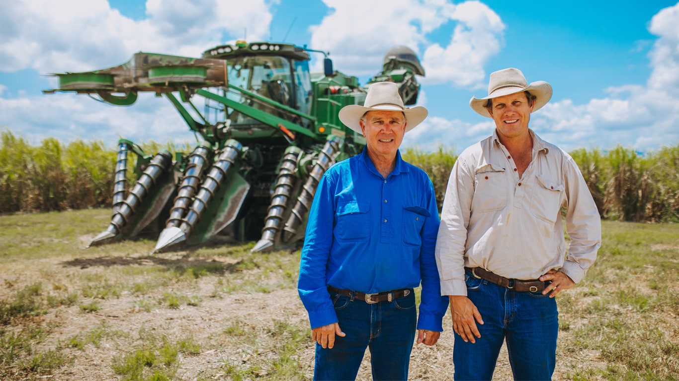 Neville and Chris Condon with the new John Deere CH960 on their Tully cane property