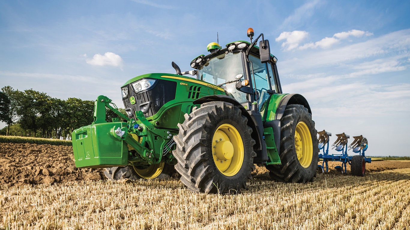 6155M Tractor in a field