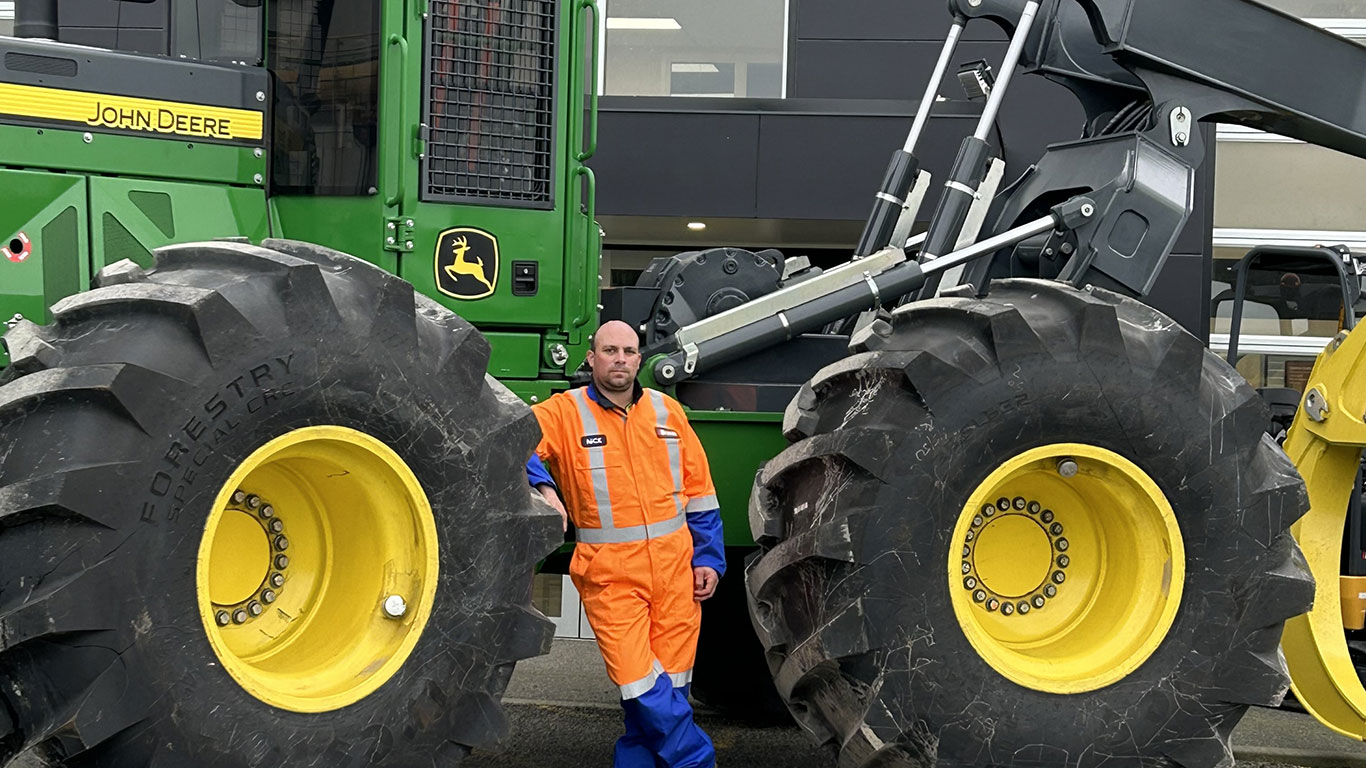 Nick Fargher in front of John Deere equipment