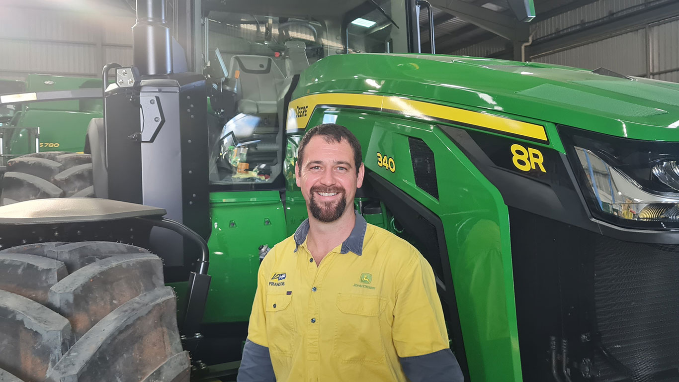 Francois Groenewald in front of John Deere equipment