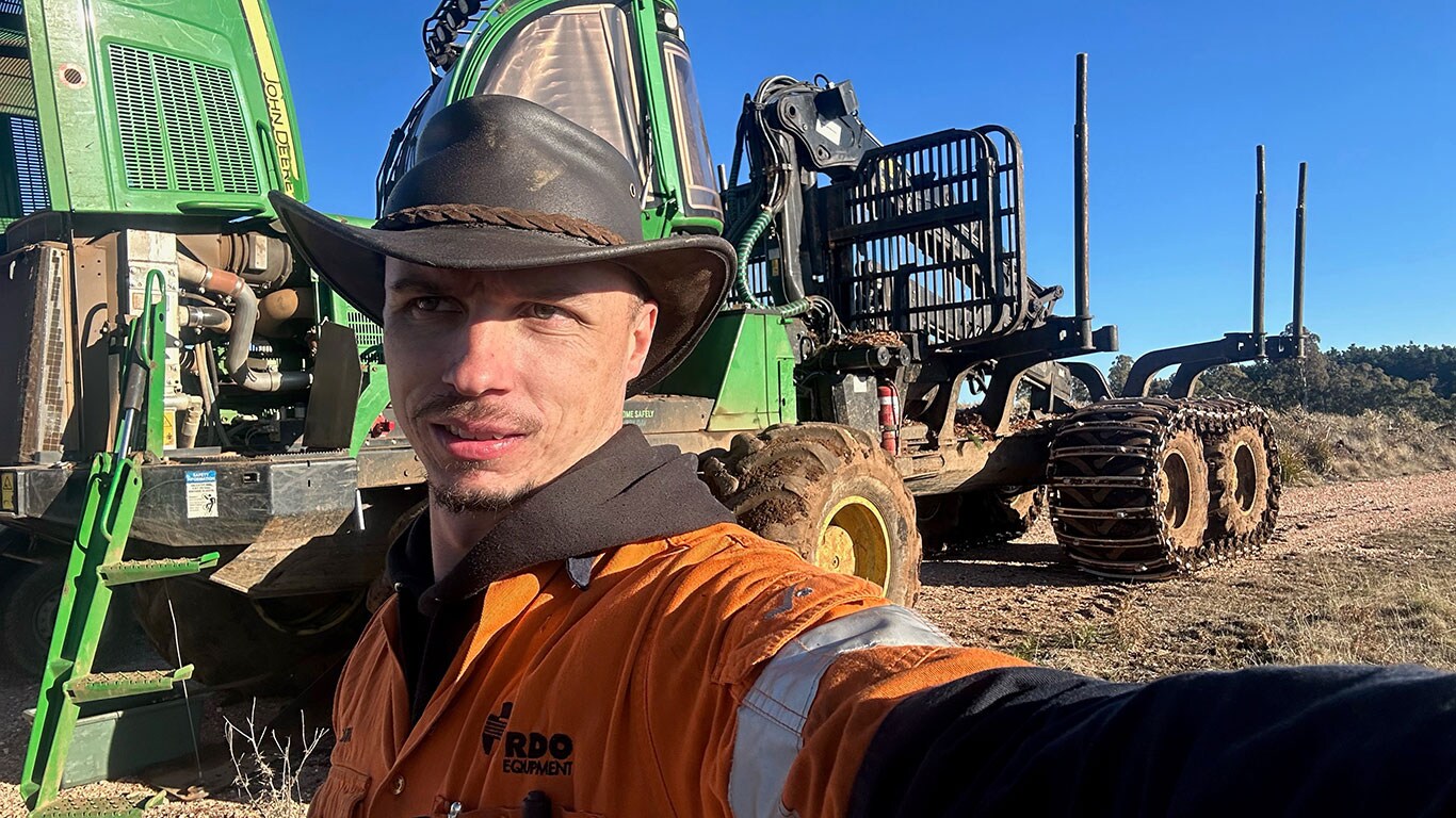 Mark Muller in front of John Deere equipment