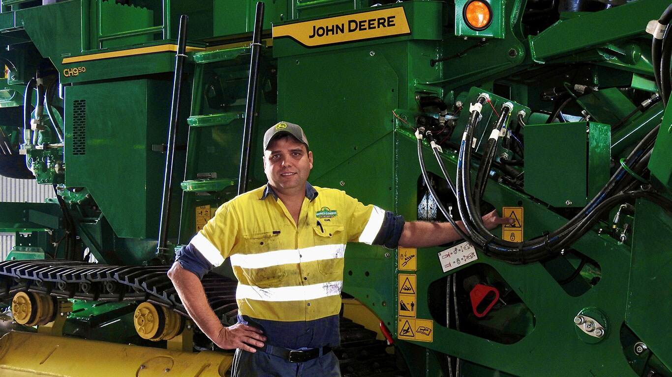 Karl Moschella in front of John Deere equipment