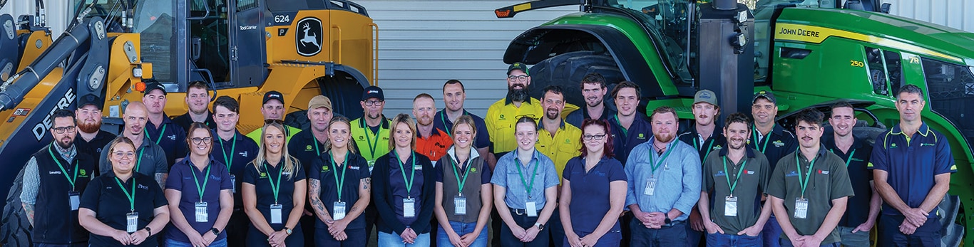 2023 Tech Awards candidates grouped in front of Deere equipment