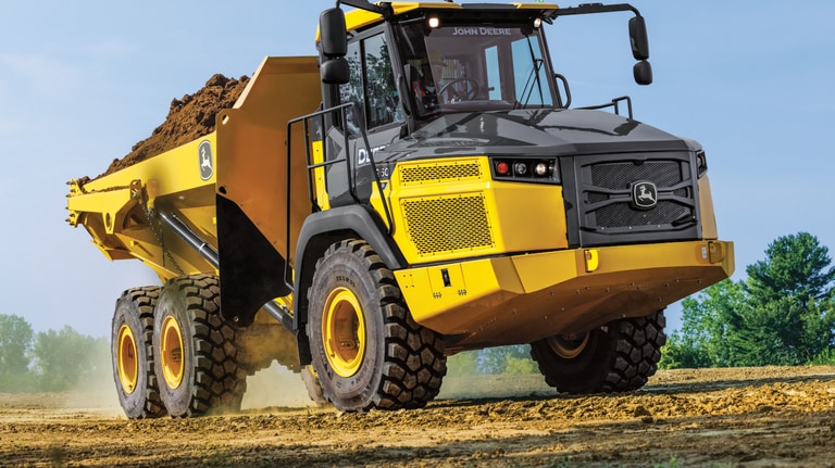 A 260P Articulated Dump Truck hauling dirt.