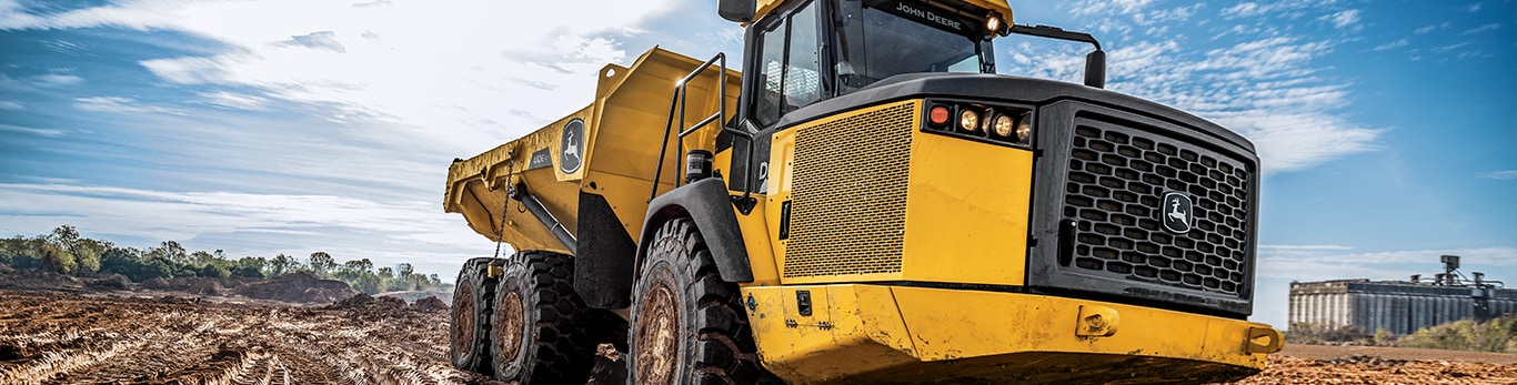 John Deere Articulated Dump Truck carries a load of dirt