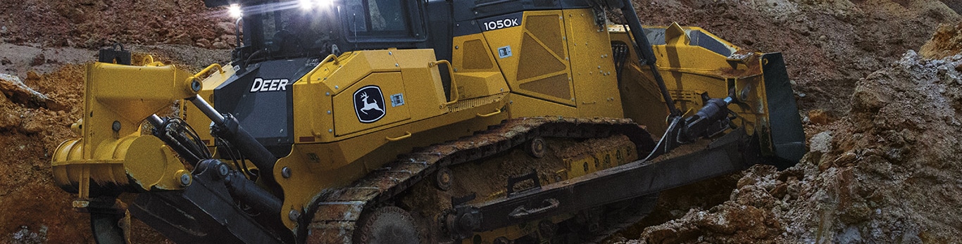 1050K Dozer pushes a dirt on a worksite