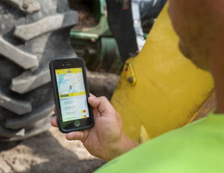 An operator views data on cell phone