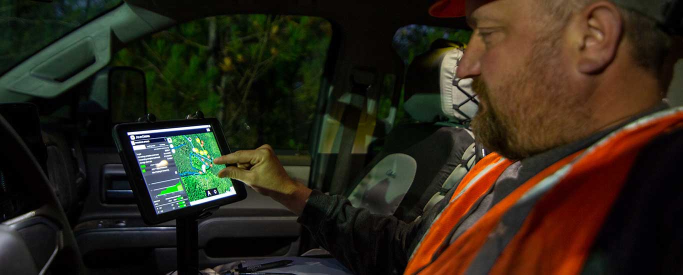 An manager views a territory map from a tablet in the truck