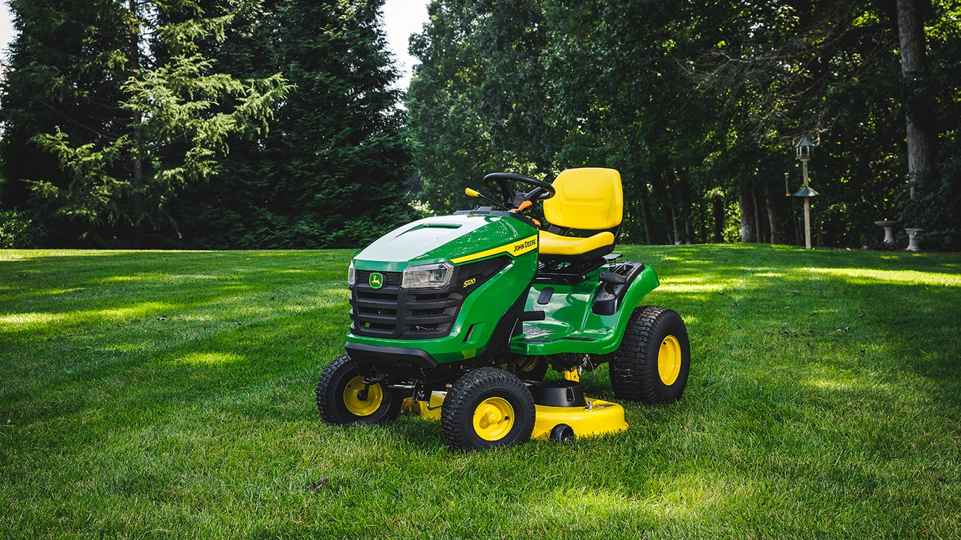 100 Series ride-on mower on residential front lawn
