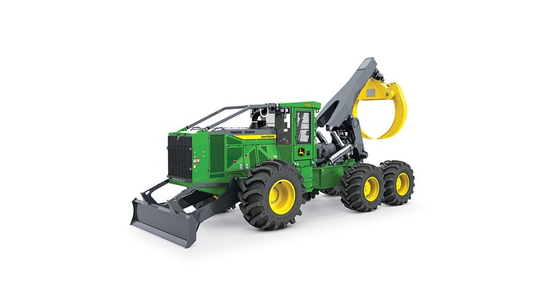 Green and yellow forestry machine with large tires and front blade for logging tasks.