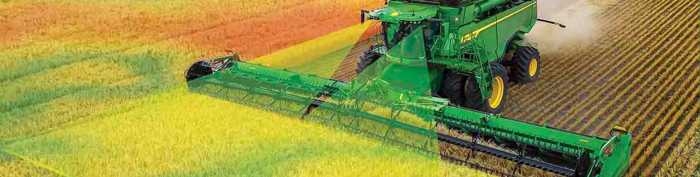 X9 combine in wheat field with superimposed data graphics