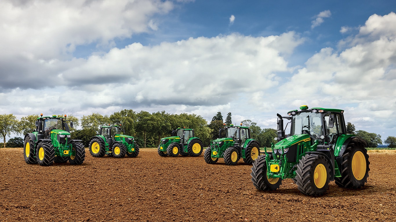 Tractors 6M Series 125 150 220 250 parked in a field