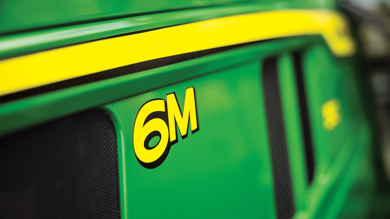 close up of 6M logo on a tractor