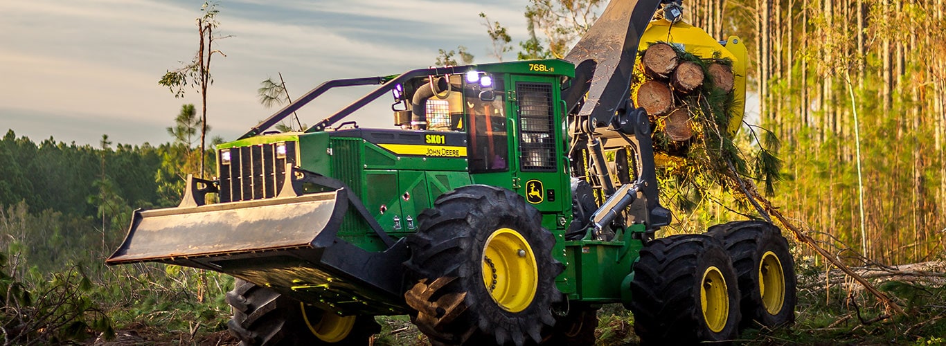 Grapple skidder hauling a load of logs