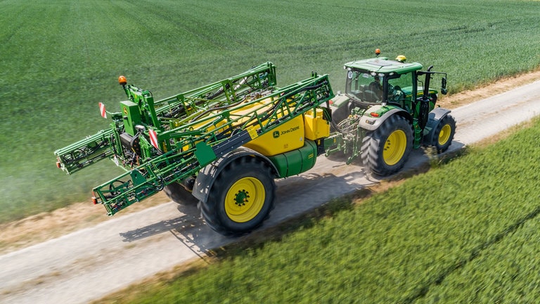 tractor pulling a sprayer that