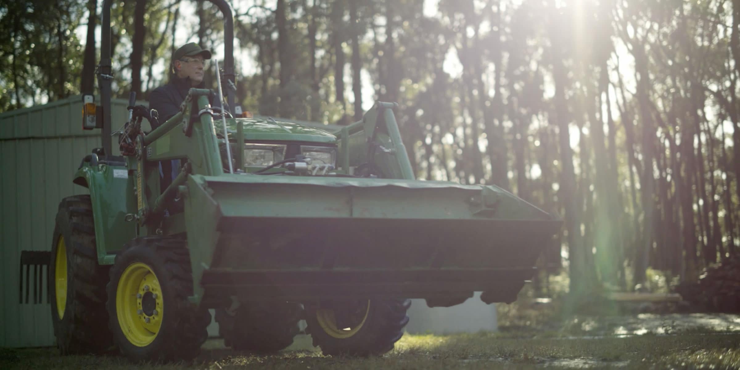 David Books driving his John Deere utility tractor
