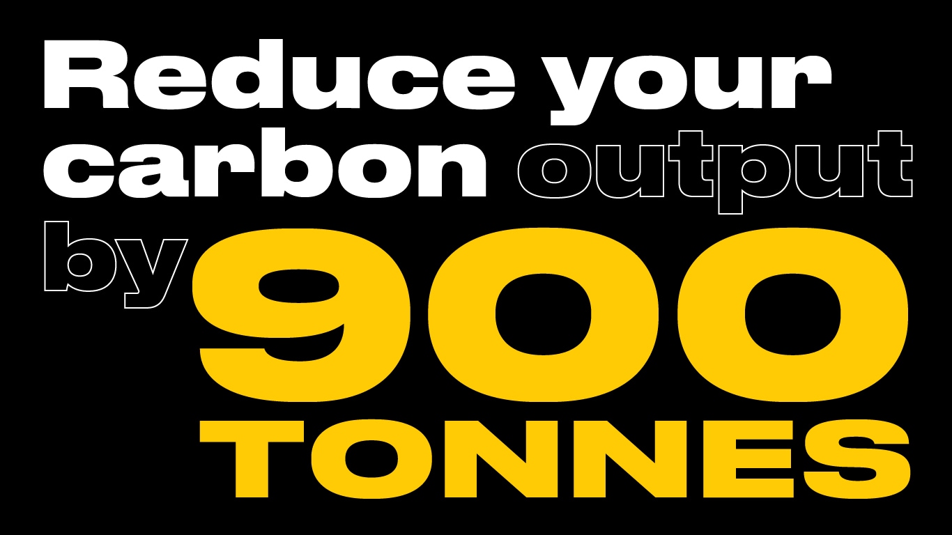 Text on a black background promoting a reduction of carbon output by 900 tonnes, emphasizing environmental responsibility.