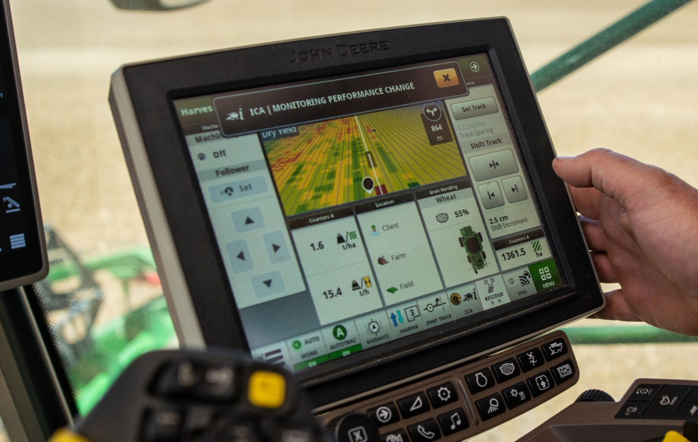 technician working on harvesting equipment