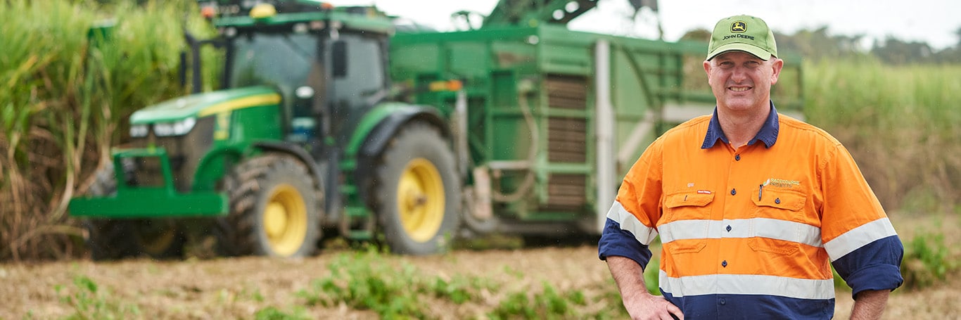George Williams in front of tractor