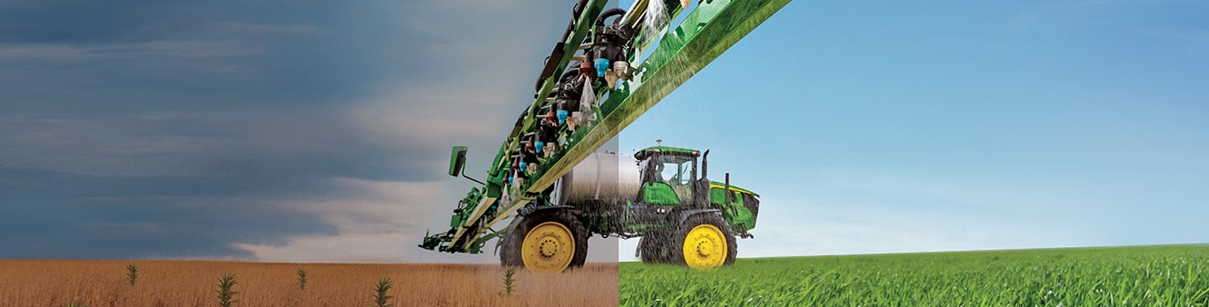 Sprayer in a half dry and half green field spraying.