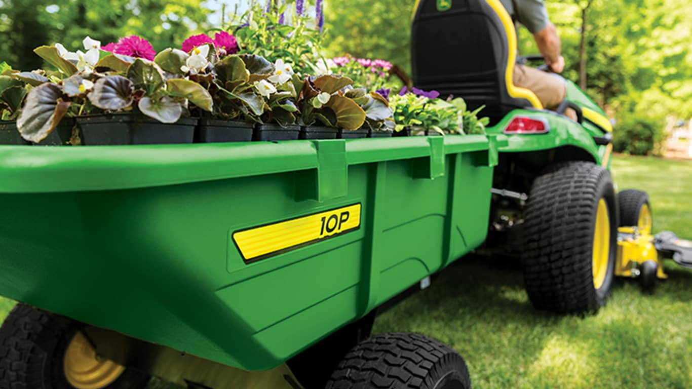 Ride on mower cart attachment for convenient yard work.