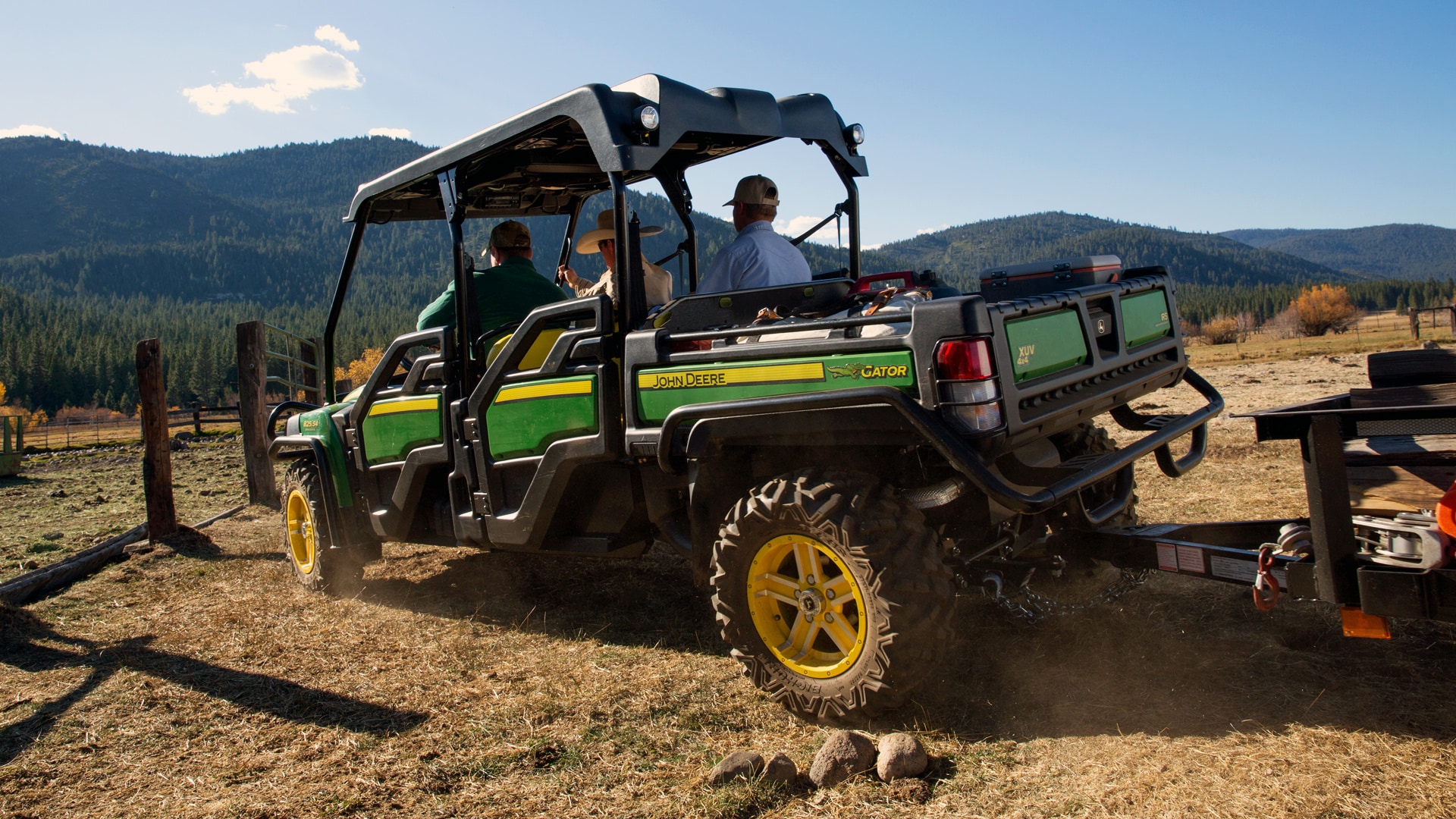 Image of gator farm buggy in field with mountains