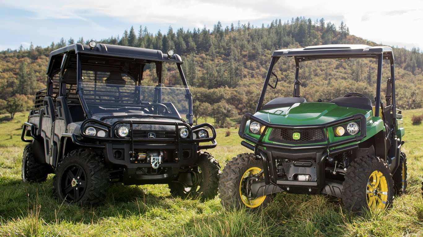 image of two crossover gator off-road dirt buggies in rolling hills