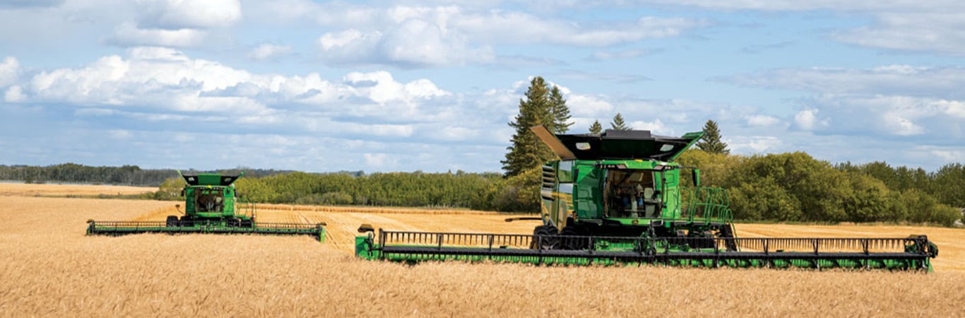 John Deere X9 combine harvesting wheat