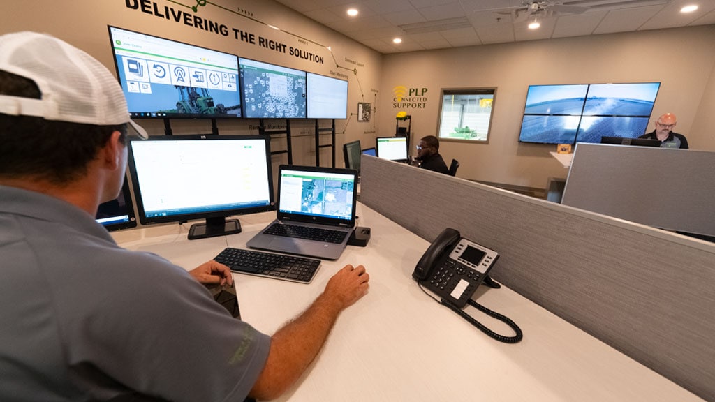 office view of computers and man working at them