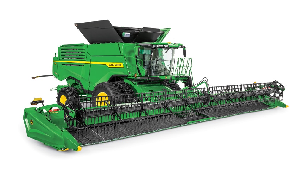 a John Deere X9 1100 Combine with a draper head, on a white background
