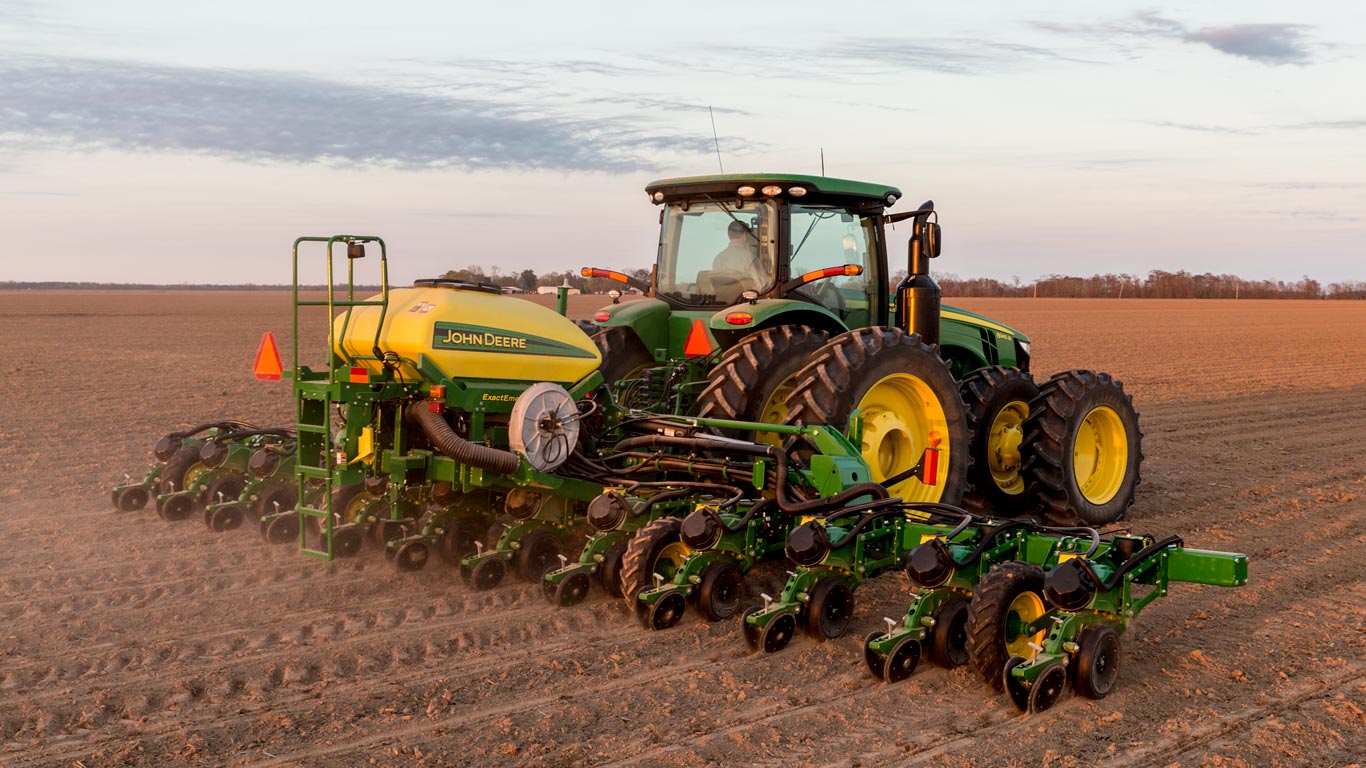 John Deere mounted planter in field