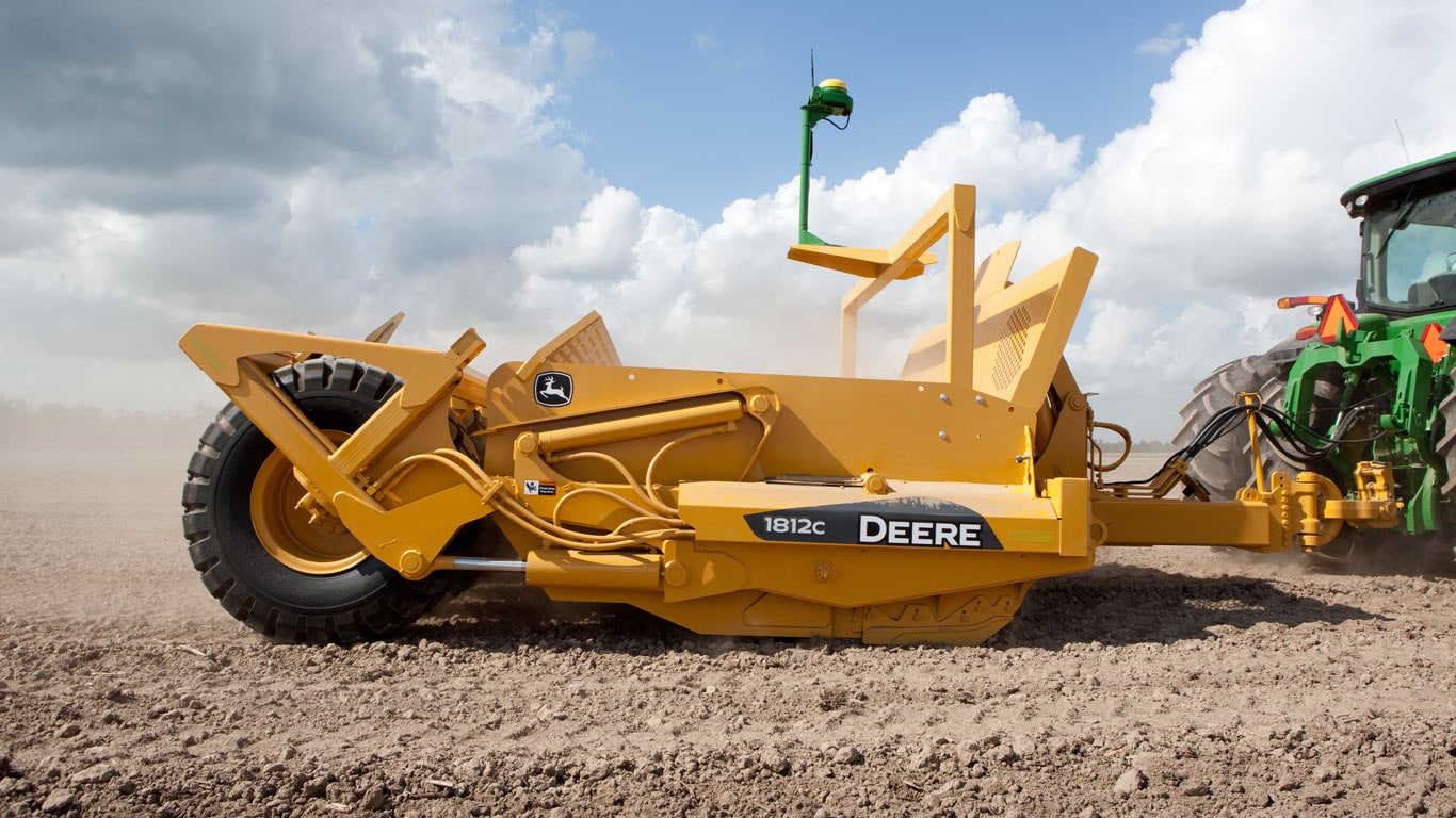 image of carry-all scraper in dusty field