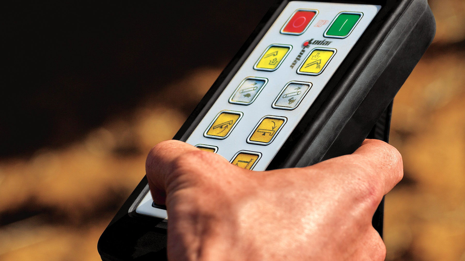 close up image of hands holding control panel