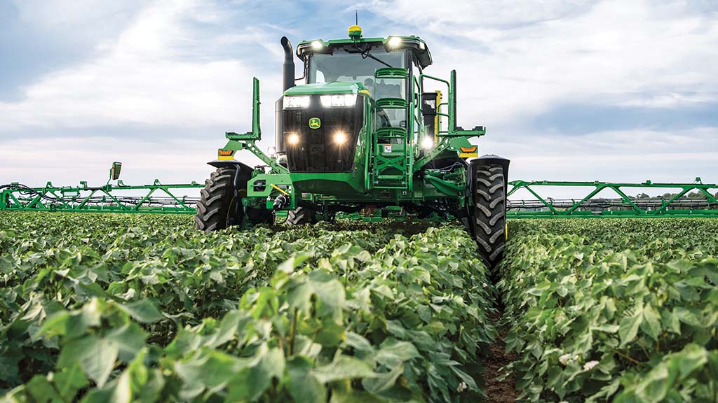 Self-propelled sprayer target spraying herbicide in soybean field.