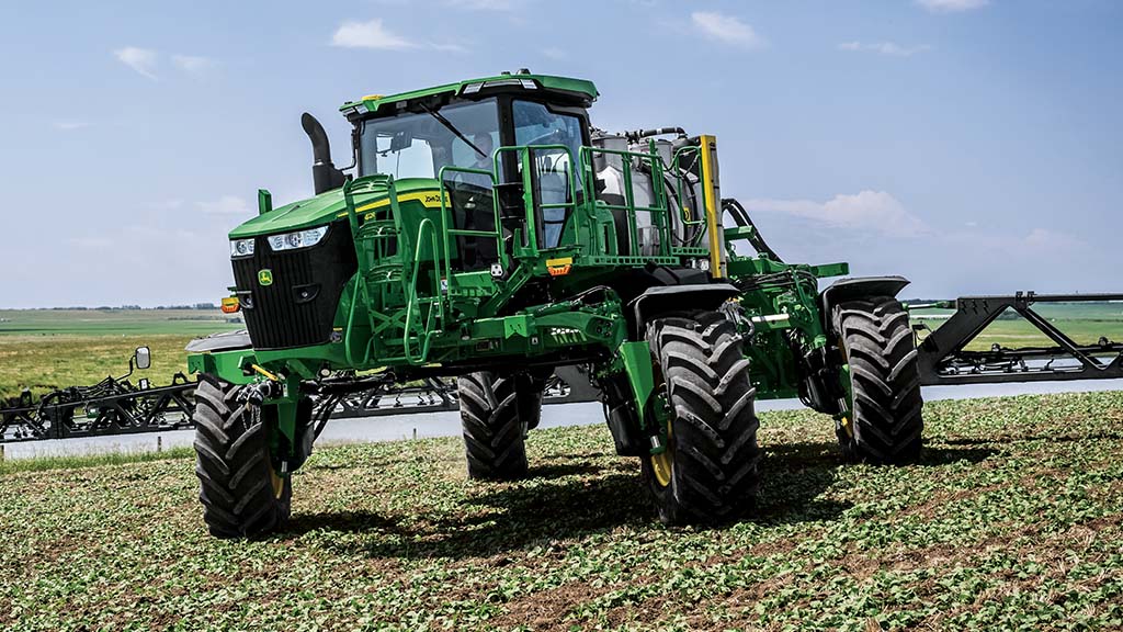 Self-propelled sprayer moving diagonally via crab steer.