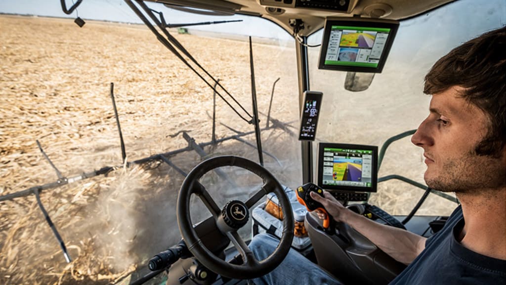 picture of Combine Advisor in use in the cab of John Deere equipment
